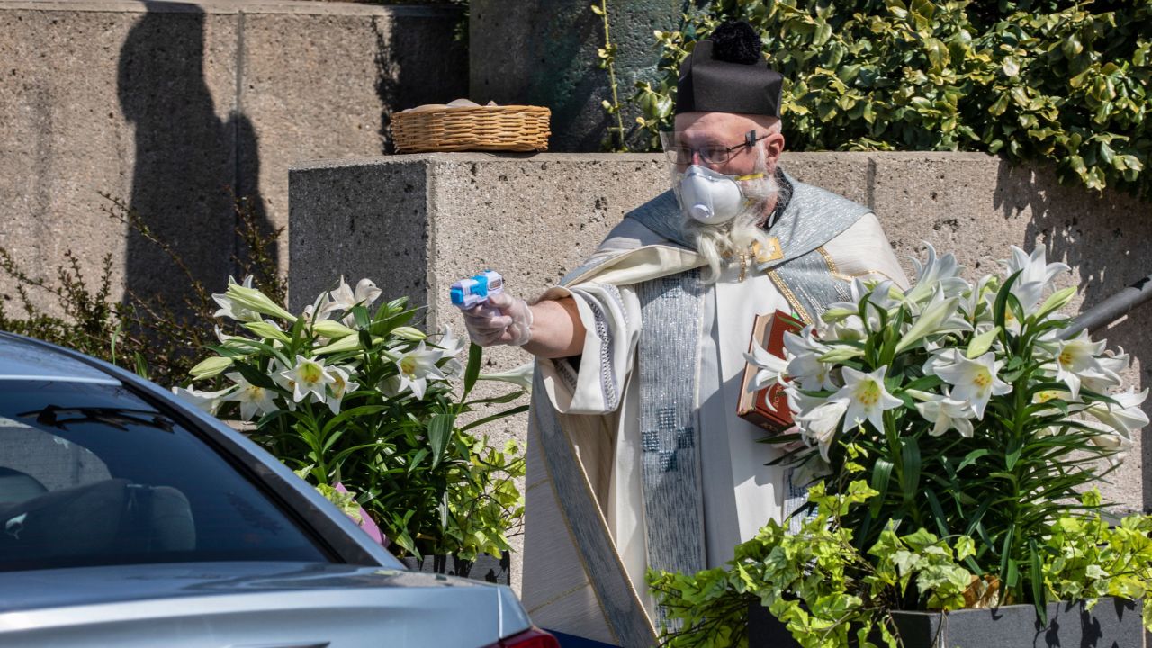 200518132903-01-priest-shoots-holy-water.jpg